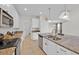 Spacious kitchen featuring granite countertops, stainless steel appliances, and a double sink at 2985 Banana Palm Dr, Kissimmee, FL 34747