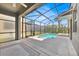 A screened-in pool area that offers a refreshing escape with clear blue water and plenty of space for lounging at 2985 Banana Palm Dr, Kissimmee, FL 34747