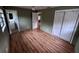 Bedroom featuring wood-look flooring, ceiling fan, closet and ensuite bathroom at 31 S Edgemon Ave, Winter Springs, FL 32708