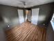Bedroom featuring wood-look flooring, ceiling fan, and closet at 31 S Edgemon Ave, Winter Springs, FL 32708