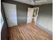 Bedroom featuring wood-look flooring, ceiling fan, and closet at 31 S Edgemon Ave, Winter Springs, FL 32708