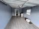 Spacious laundry room featuring stylish tiled floors, washer, dryer hookups, and overhead garage door at 31 S Edgemon Ave, Winter Springs, FL 32708