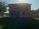 Exterior back view of home with large lawn and back porch at 3102 Westbrook Rd, Kissimmee, FL 34746