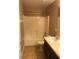 Bathroom with a bathtub and sink with tile flooring at 3102 Westbrook Rd, Kissimmee, FL 34746