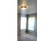Bedroom featuring neutral walls and two windows at 3102 Westbrook Rd, Kissimmee, FL 34746