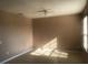 Bright, vacant bedroom with neutral walls, ceiling fan, and sun-drenched tiled floor at 3102 Westbrook Rd, Kissimmee, FL 34746