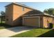 Two-car garage and long driveway at 3102 Westbrook Rd, Kissimmee, FL 34746