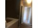 Upstairs hallway featuring carpet and neutral walls at 3102 Westbrook Rd, Kissimmee, FL 34746