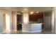 Open-concept kitchen featuring dark cabinetry and a breakfast bar at 3102 Westbrook Rd, Kissimmee, FL 34746