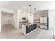 Modern kitchen featuring granite countertops, stainless steel appliances, and a center island with pendant lighting at 33263 Rembrandt Ln, Sorrento, FL 32776