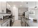 Well-equipped kitchen with granite countertops, stainless steel appliances, and ample cabinet space at 33263 Rembrandt Ln, Sorrento, FL 32776