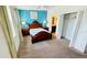 Comfortable bedroom featuring a cozy bed, carpeted floors, and a closet at 349 Captiva Dr, Davenport, FL 33896
