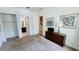 Bright bedroom with carpet, closet, dresser, decorations, and access to the stairs and the ensuite bath at 349 Captiva Dr, Davenport, FL 33896