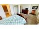 Comfortable bedroom with soft carpet, TV, and an ensuite bathroom at 349 Captiva Dr, Davenport, FL 33896