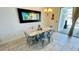 Cozy dining area situated near the pool access with seating for six at 349 Captiva Dr, Davenport, FL 33896