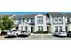 Well-maintained townhomes feature neutral paint, decorative trim, and convenient parking at 349 Captiva Dr, Davenport, FL 33896