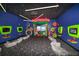 Fun game room features neon lights, multiple monitors, and zebra print seating at 349 Captiva Dr, Davenport, FL 33896