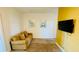 Cozy living room with plush couch, neutral walls with stylish decor, and a wall-mounted television at 349 Captiva Dr, Davenport, FL 33896