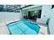 Enclosed pool and patio area featuring comfortable lounge seating for relaxing and entertaining outdoors at 349 Captiva Dr, Davenport, FL 33896
