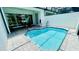 Private pool with adjacent patio seating offering a relaxing space for outdoor enjoyment and leisure at 349 Captiva Dr, Davenport, FL 33896
