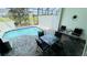 Serene outdoor patio with a private pool, outdoor seating area for relaxation and entertaining at 349 Captiva Dr, Davenport, FL 33896