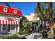 Charming shops feature an ice cream parlor and sports store with colorful awnings and lush landscaping at 349 Captiva Dr, Davenport, FL 33896