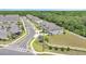 View of a townhouse community with manicured landscaping and ample parking at 3617 Anibal St, Kissimmee, FL 34746