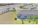Aerial view of the backyard featuring a patio area with outdoor seating and an adjacent grass space at 3617 Anibal St, Kissimmee, FL 34746