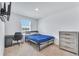 This bedroom has modern neutral colors and a convenient workstation at 3617 Anibal St, Kissimmee, FL 34746