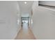 Hallway featuring tile flooring, leading to the main living area at 3617 Anibal St, Kissimmee, FL 34746