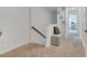 Upstairs hallway features neutral carpet, built in bench and decor at 3617 Anibal St, Kissimmee, FL 34746