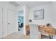 Bright home office featuring a modern desk and neutral color palette with view into bedroom at 3617 Anibal St, Kissimmee, FL 34746