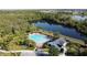 Community pool, pond, and the recreation building creates a welcoming outdoor retreat at 3690 Maidencain St, Clermont, FL 34714