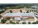 Exterior shot of a community school with a large parking lot and field in the background at 3690 Maidencain St, Clermont, FL 34714