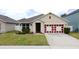 Charming single-Gathering home with manicured lawn and a two-car garage in a suburban neighborhood at 3690 Maidencain St, Clermont, FL 34714