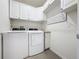 Bright laundry room features a full sized washer and dryer at 3690 Maidencain St, Clermont, FL 34714