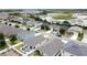 Aerial view capturing a well-planned neighborhood adjacent to scenic wetlands, offering a serene living environment at 3690 Maidencain St, Clermont, FL 34714