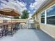 Built-in outdoor kitchen and bar with a grill, perfect for outdoor entertaining at 3690 Maidencain St, Clermont, FL 34714
