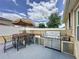 Built-in outdoor kitchen and bar with a grill for culinary creations under the sun at 3690 Maidencain St, Clermont, FL 34714