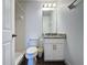 Cozy bathroom showcasing white tile shower and vanity with marble counter at 394 Orange Cosmos Blvd, Davenport, FL 33837