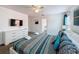 Spacious primary bedroom with ceiling fan and decoratively furnished with mounted TV at 394 Orange Cosmos Blvd, Davenport, FL 33837