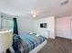 Primary bedroom featuring a ceiling fan and a mounted wall TV at 394 Orange Cosmos Blvd, Davenport, FL 33837