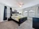 A spacious bedroom with soft carpet, a large bed, and a window with dual curtains at 394 Orange Cosmos Blvd, Davenport, FL 33837