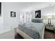 Comfortable bedroom featuring stylish decor, a plush bed, and soft carpeting for a warm and inviting atmosphere at 394 Orange Cosmos Blvd, Davenport, FL 33837