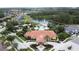 Overhead shot of the community center including a serene lake and pool area with decorative fountains at 394 Orange Cosmos Blvd, Davenport, FL 33837