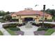 Beautiful community center showcasing manicured grounds and decorative fountain at the entrance at 394 Orange Cosmos Blvd, Davenport, FL 33837