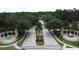 Stunning community entrance featuring lush gardens, fountains, and ornate architectural details at 394 Orange Cosmos Blvd, Davenport, FL 33837