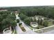 Gorgeous aerial view of the community entrance with lush landscaping and decorative fountains at 394 Orange Cosmos Blvd, Davenport, FL 33837