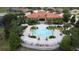 Aerial view of the community pool offering a luxurious experience and plenty of lounging areas at 394 Orange Cosmos Blvd, Davenport, FL 33837