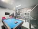 Fun game room features a pool table, Star Wars mural, and a foosball table for entertainment at 394 Orange Cosmos Blvd, Davenport, FL 33837